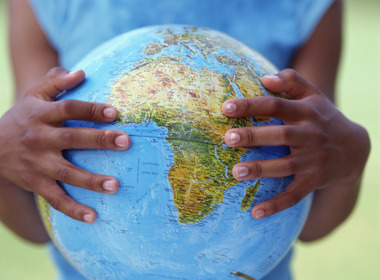 LEAP Africa Girl's hands holding globe